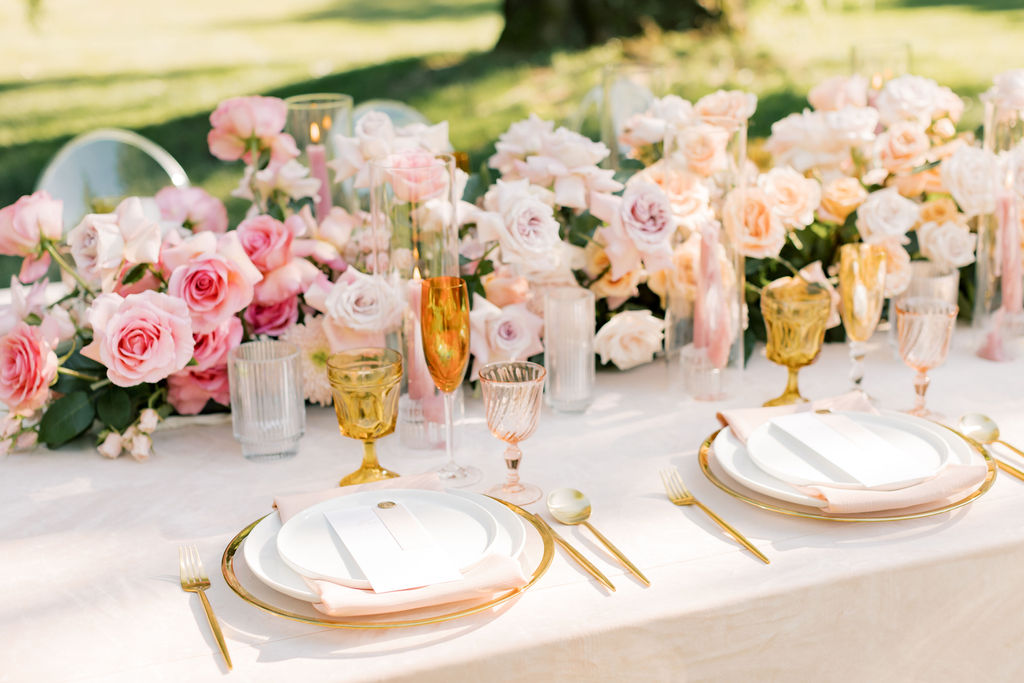 Details of a pink themed promise garden pasco wedding receptioin with gold silverware