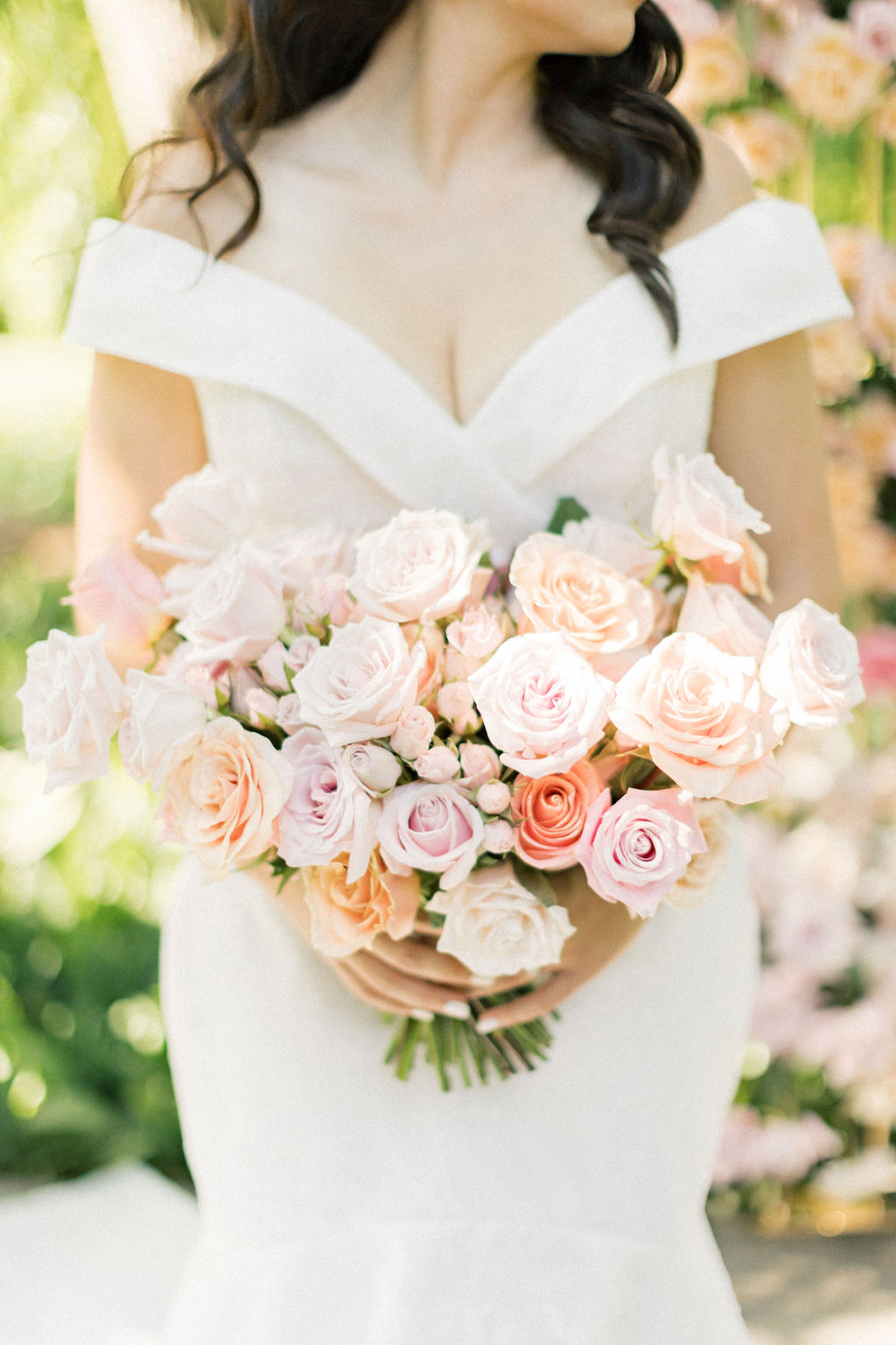 Details of a brides pink and white bouquet