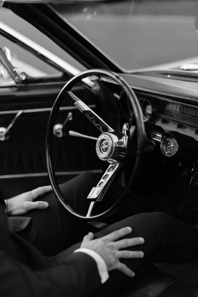 Details of a vintage 60's Ford Mustang steering wheel in black and white