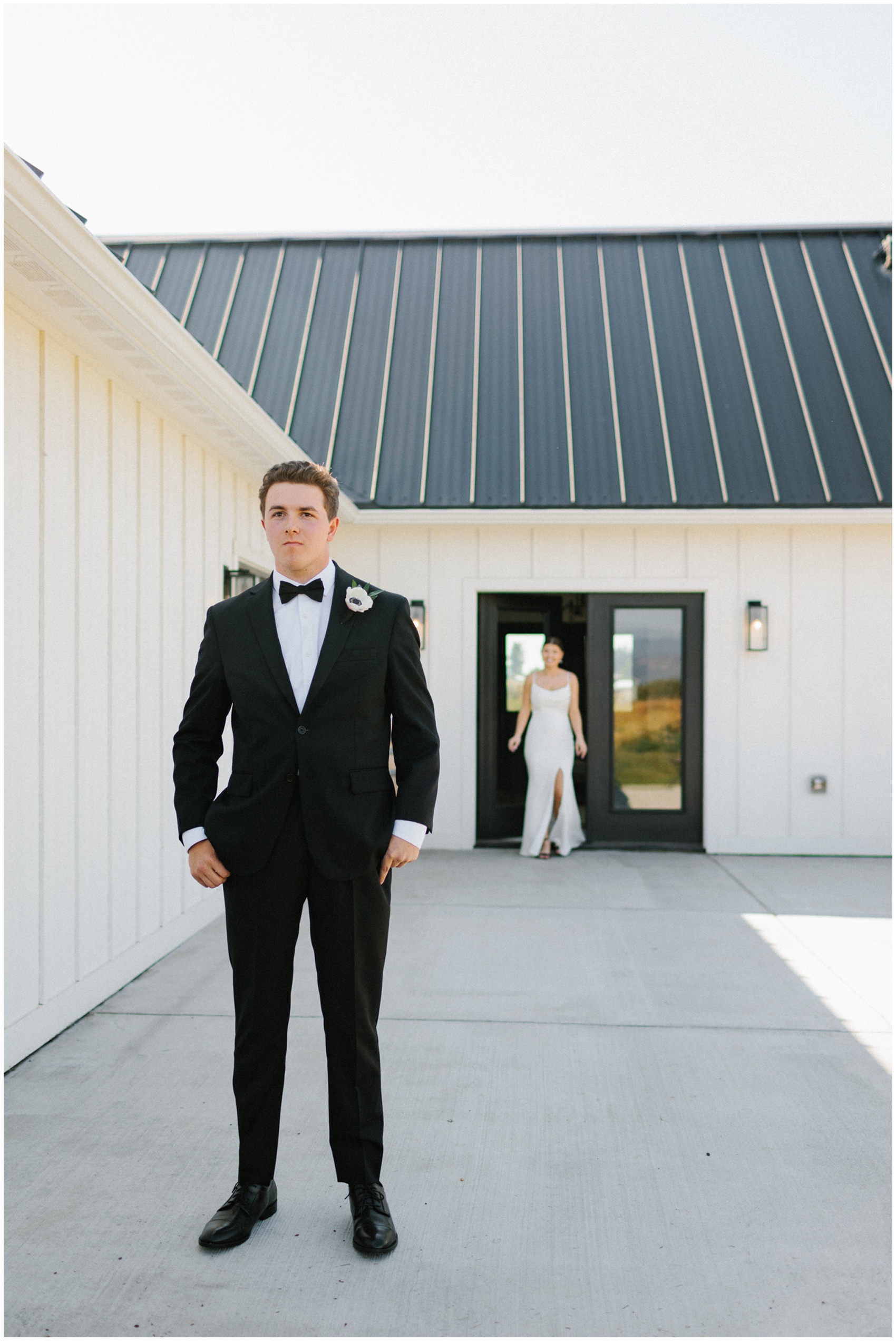 A groom nervously awaits his bride for their first look vs first touch