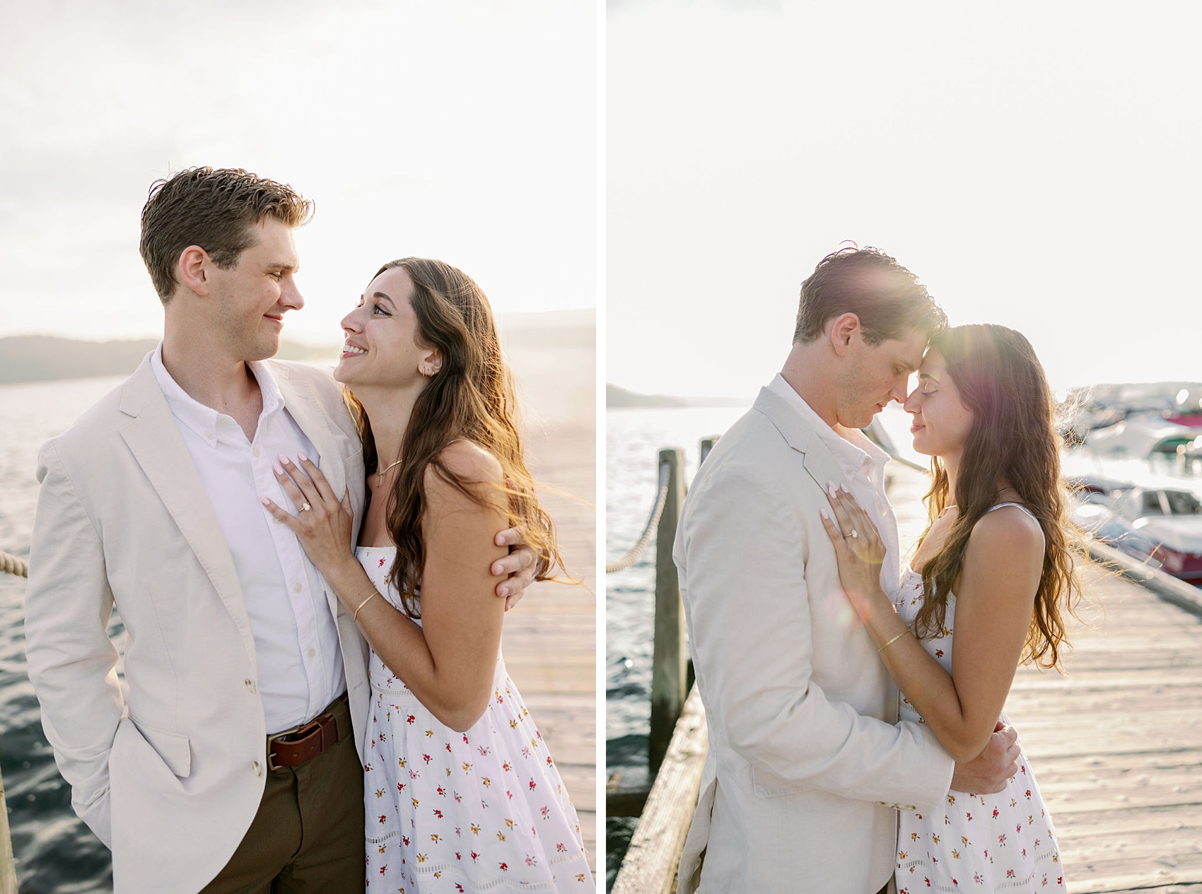A happy couple snuggle on a dock in white at sunset touching foreheads