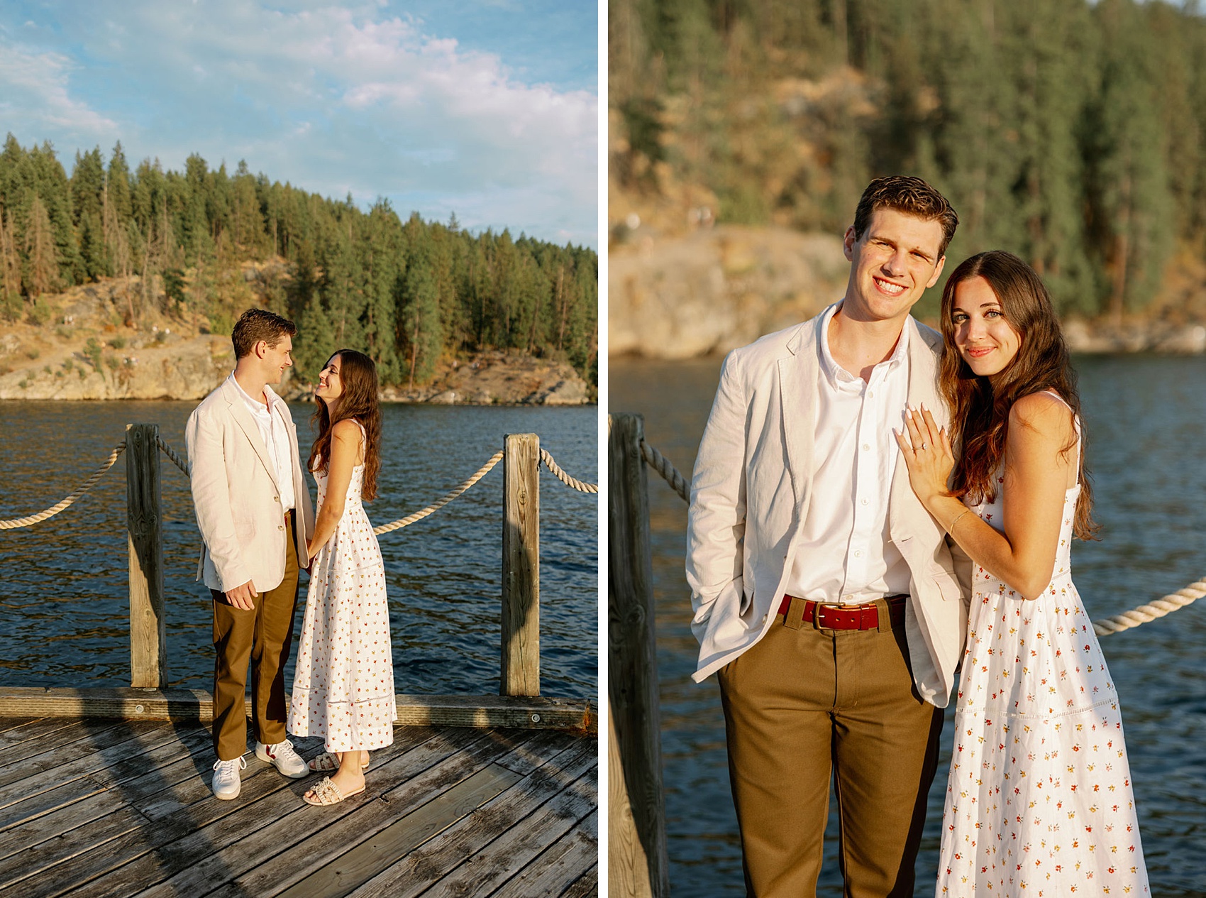 A man in a white suit jacket smiles while standing with his fiancee in a whtie dress on a dock at sunset