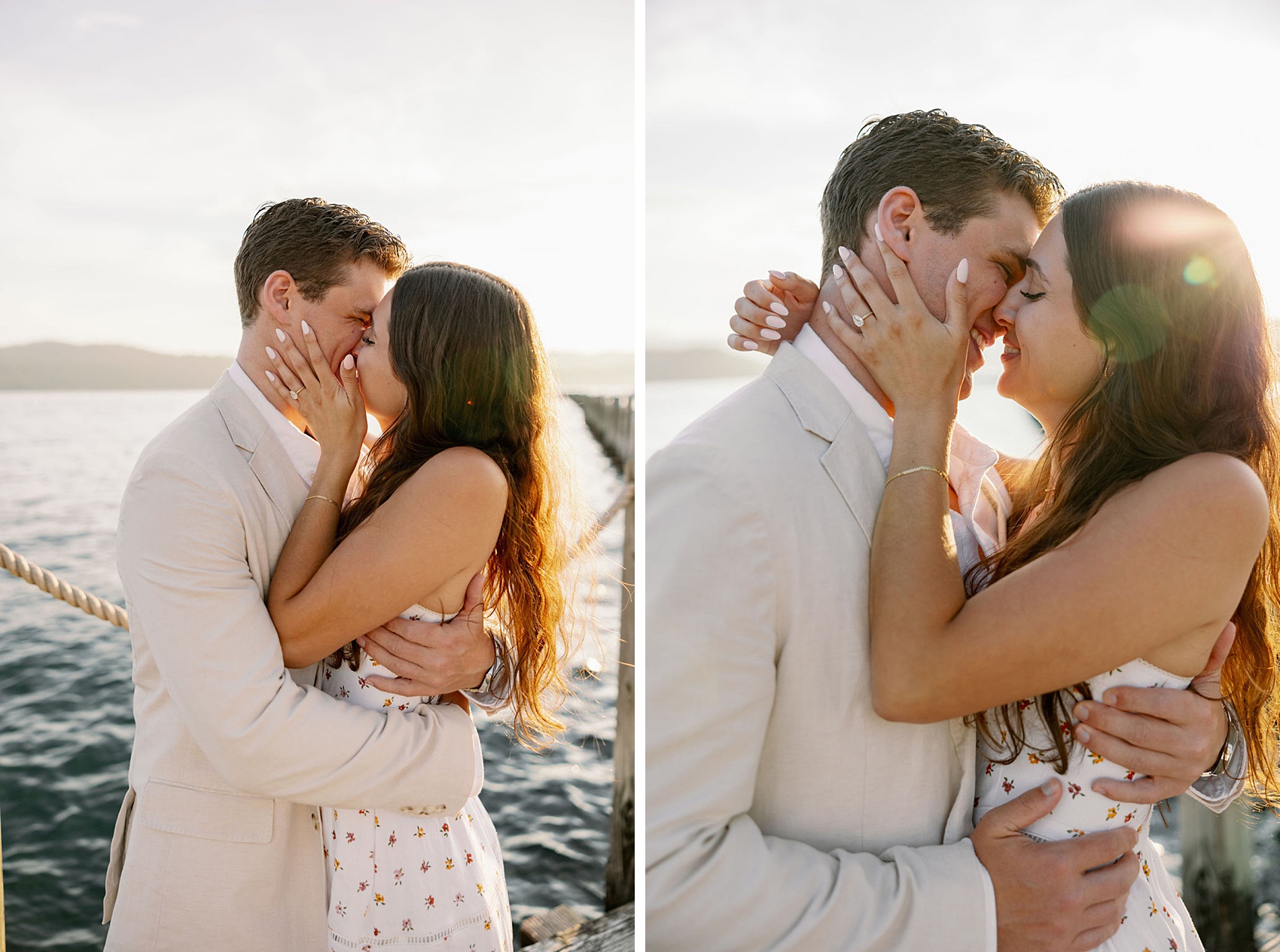 A happy engaged couple kiss at sunset on a dock